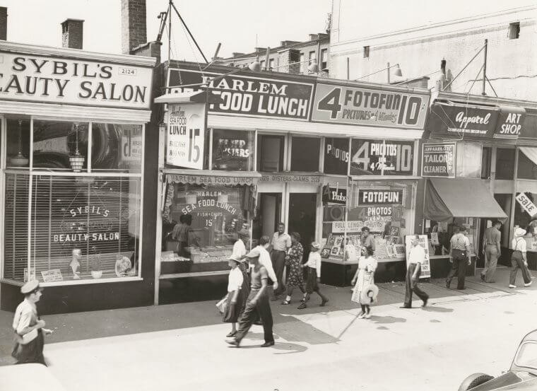 Black and white image of Harlem storefronts